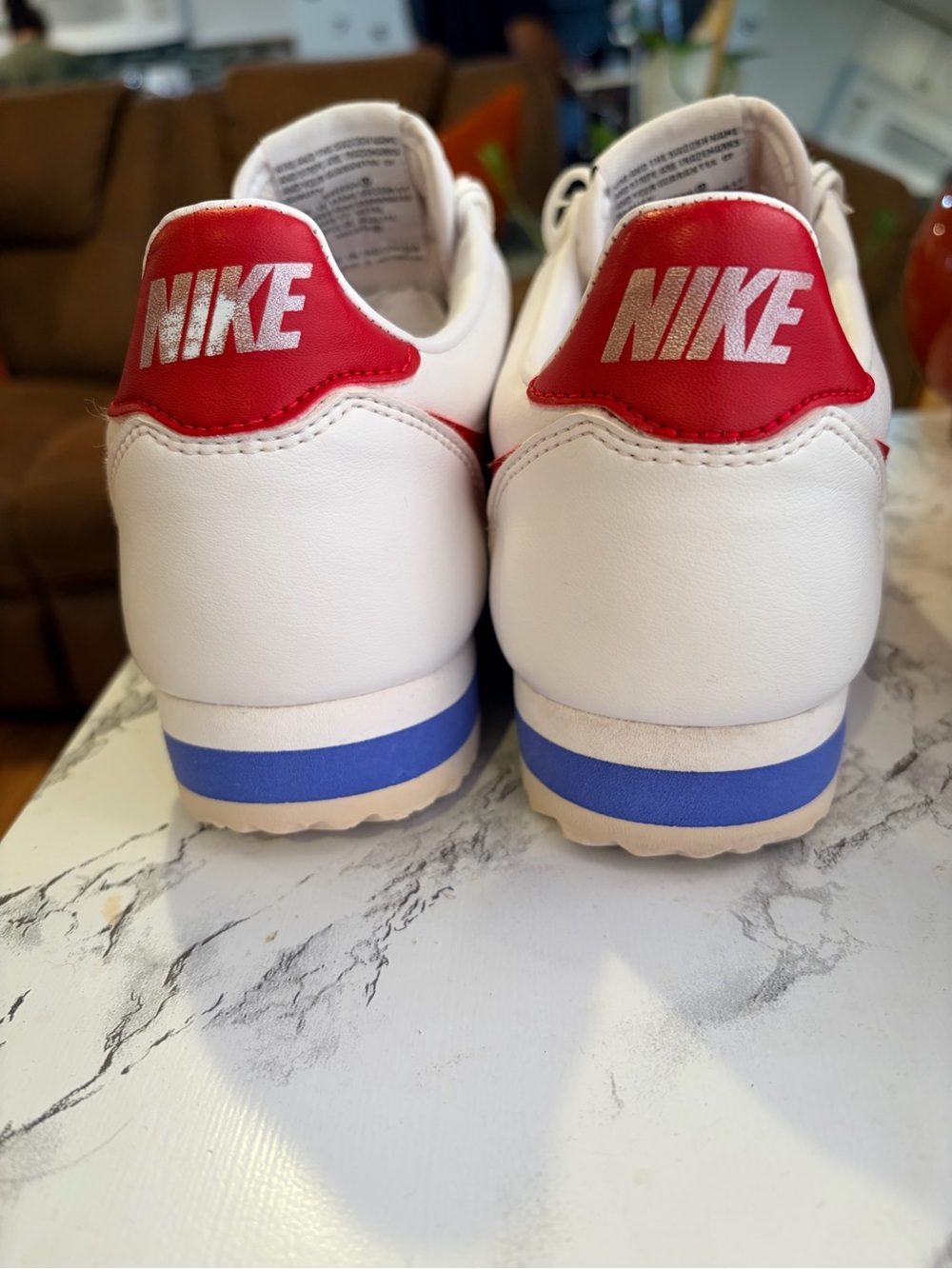 Nike Men’s White Leather Sneakers with Red Swoosh and Blue Midsole Accent - Picture 2 of 9